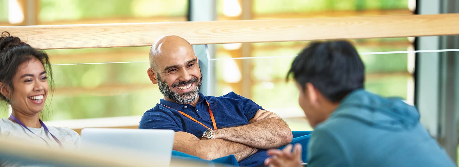 Man smiling in team meeting