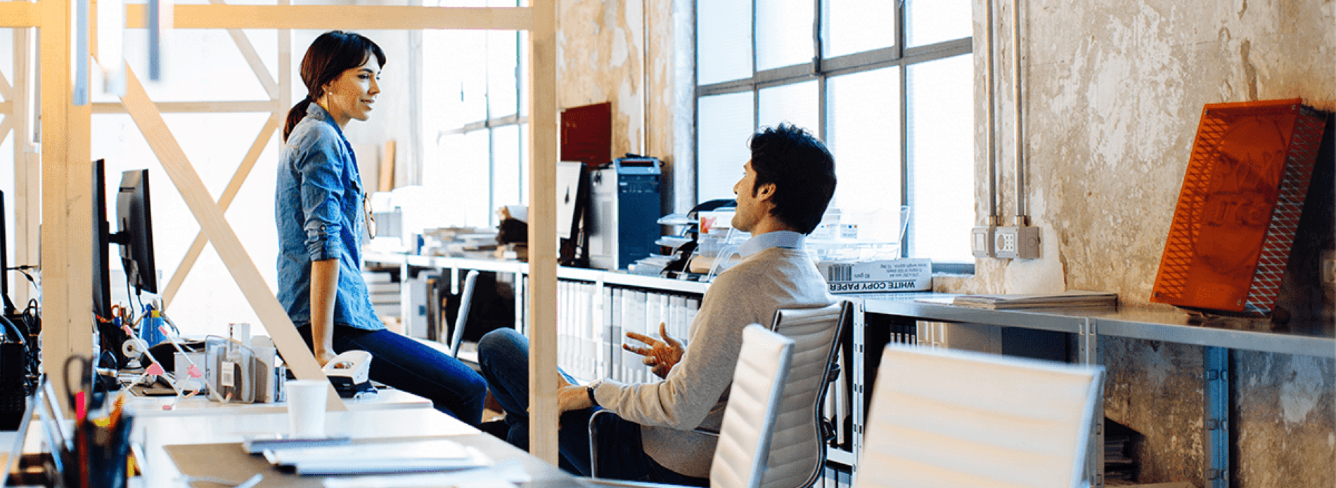 colleagues in office chatting