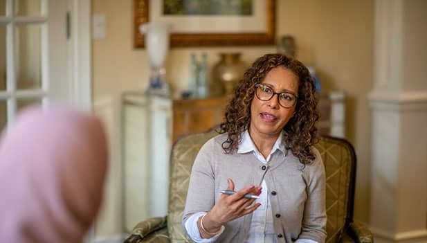 Psychologist talking to a patient 