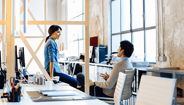 colleagues in office chatting