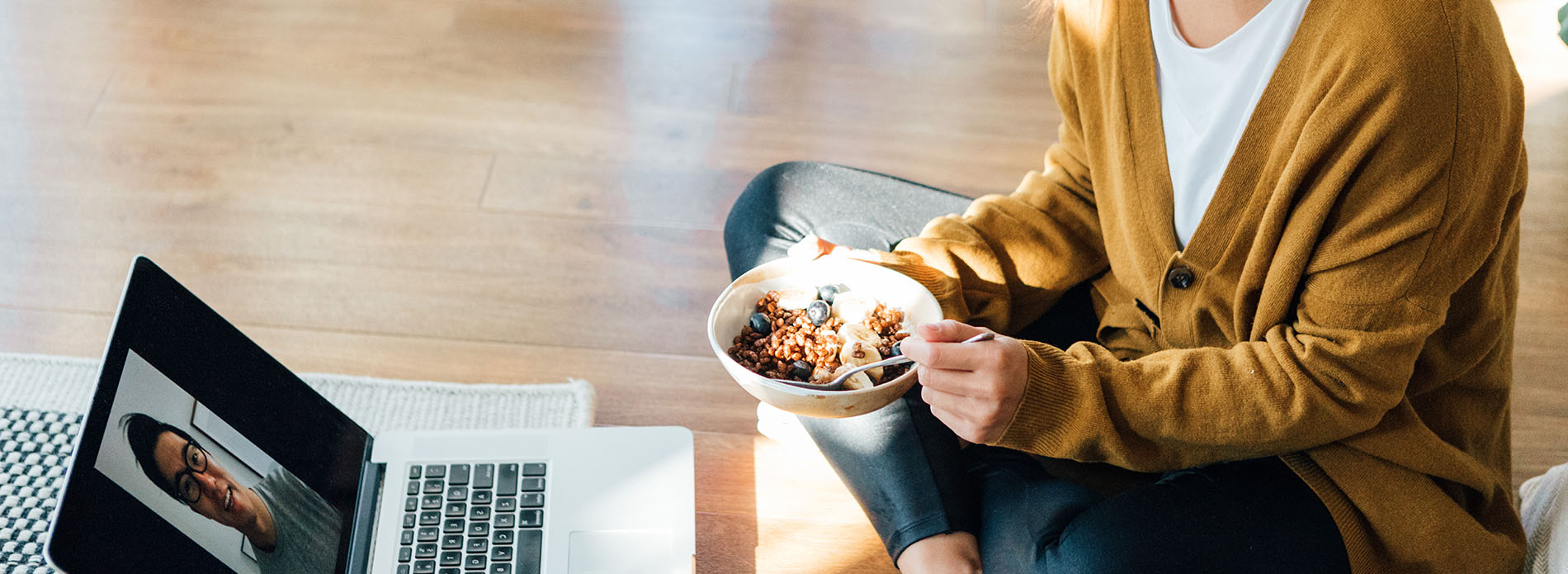 Woman eating cereal while in a Teams meeting