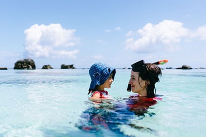 Mother and daughter swimming