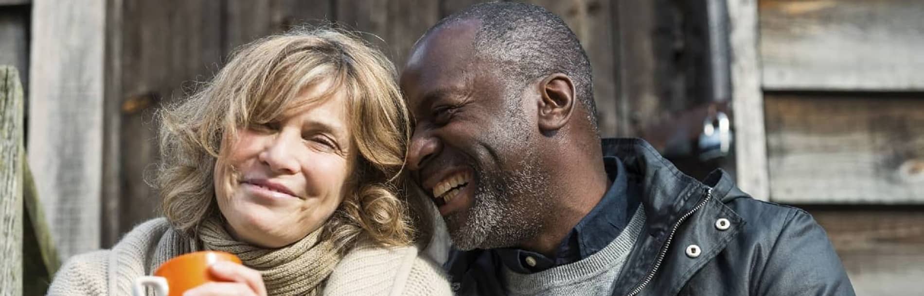 husband and wife laughing together